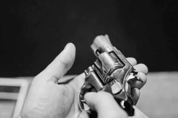 What is the legal age to own and use a firearm in Canada?